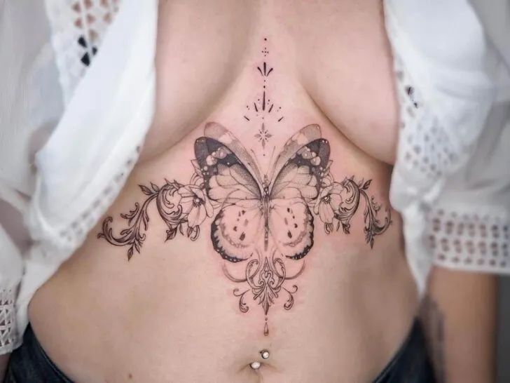 butterfly middle chest tattoo