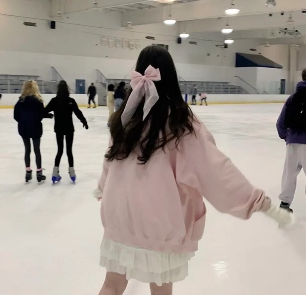 pink sweater with a white skirt