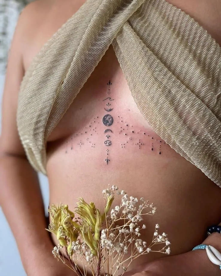 tattoo of sternum ornaments with moon phases