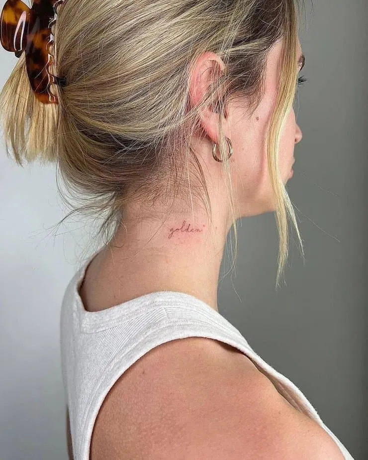 “golden” tattoo on the neck