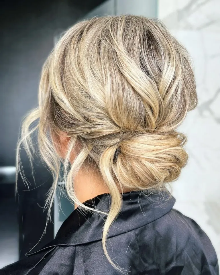 Voluminous textured low bun. Wedding hairstyle